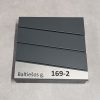 Pilka pašto dėžutė su išgraviruotu adresu „Baltėsos g. 169-2“.